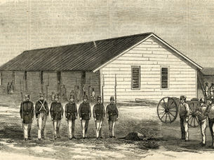Soldiers lined up in front of a building