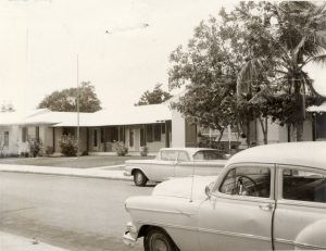 Cars in front of a building.