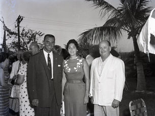 three people pose for a photo