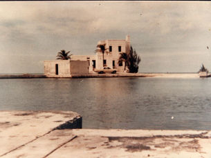 A building on the far side of a body of water