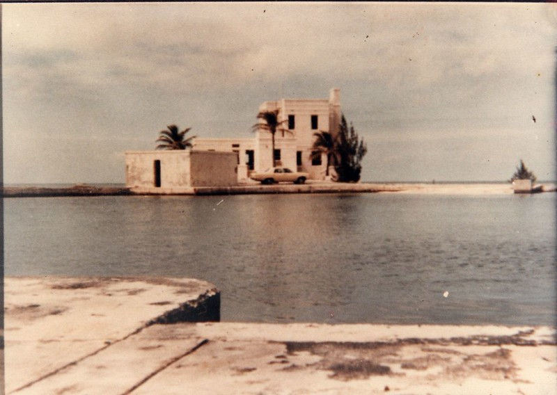 A building on the far side of a body of water.