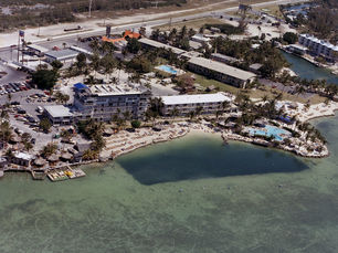 aerial view of a developed shoreline with a beach
