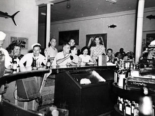a group of people at a bar