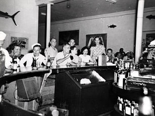 a group of people at a bar