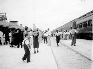 A group of people at a train station.