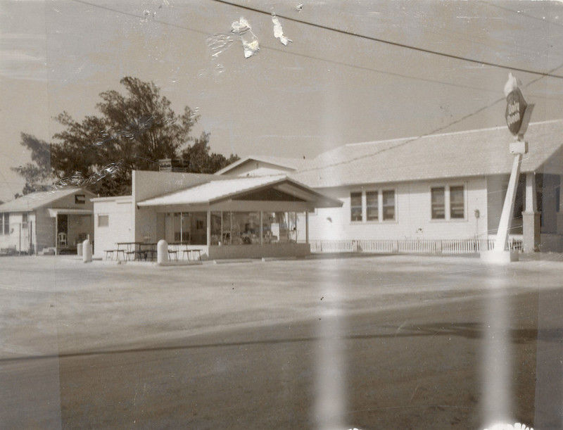 A storefront with a sign in the lot that reads Dairy Queen