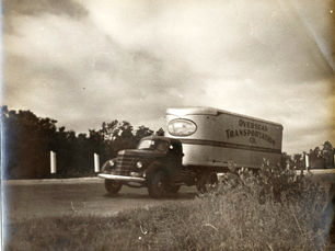 A truck with Overseas Transportation written on the side