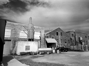 Several industrial buildings made of concrete and brick.
