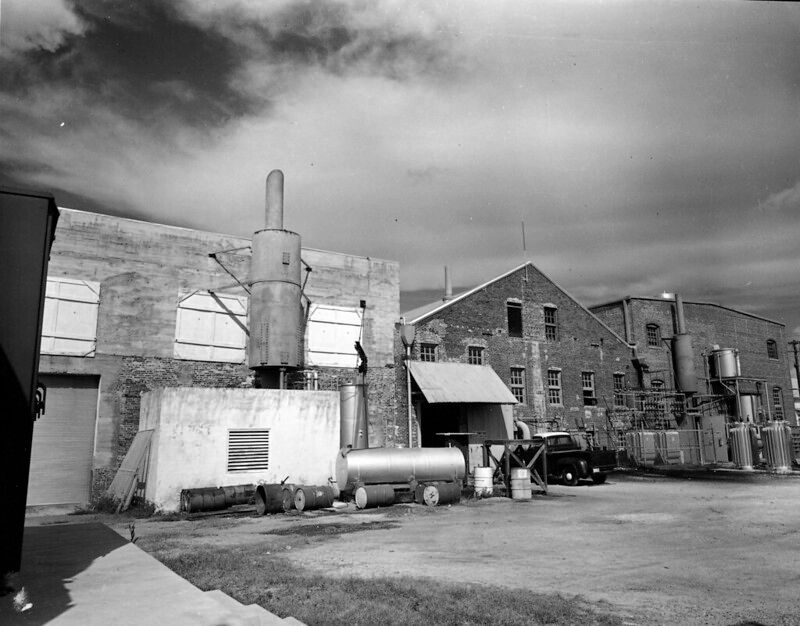 Several industrial buildings made of concrete and brick.