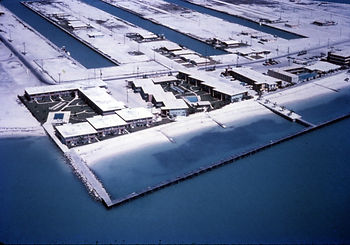 Aerial view of a shoreline with buildings and docks