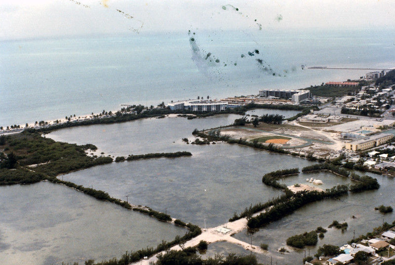 Aerial view of salt ponds on an island
