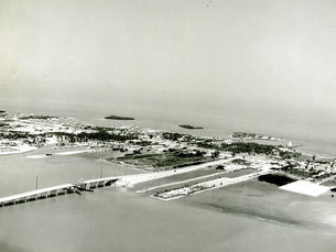 aerial view of an island with lagoons and a drawbridge in the foreground
