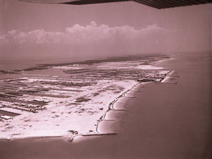 Aerial view of a sandbar with some dredged canals