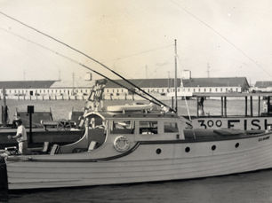 a fishing boat moored at a dock