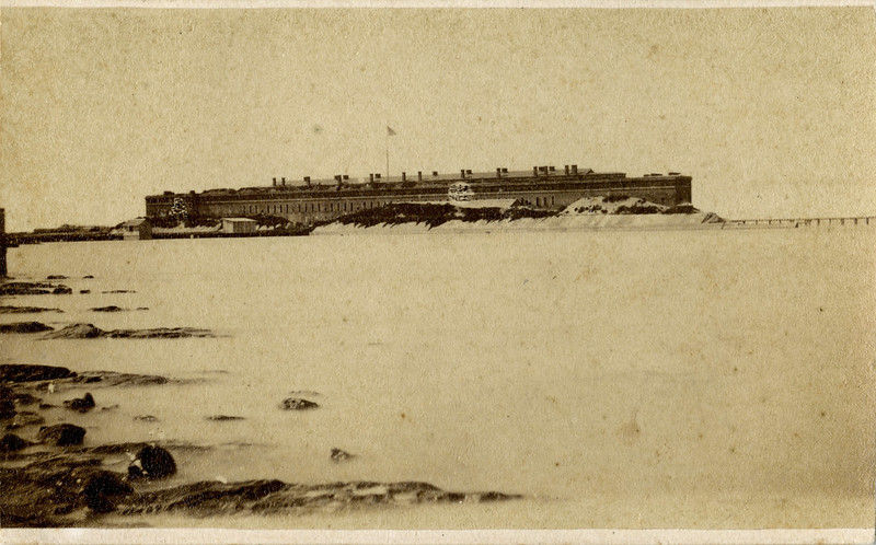 A brick fort at the edge of the water