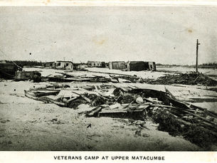 wreckage on the ground. text on bottom reads Veterans camp at Upper Matacumbe.
