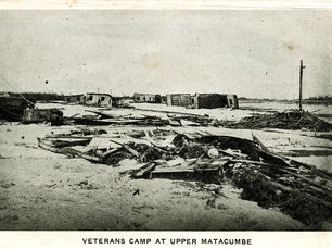 wreckage on the ground. text on bottom reads Veterans camp at Upper Matacumbe.