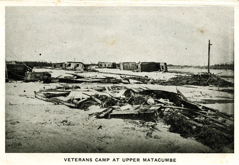 A postcard showing wreckage on the ground. Text at bottom reads Veterans Camp at Upper Matacumbe