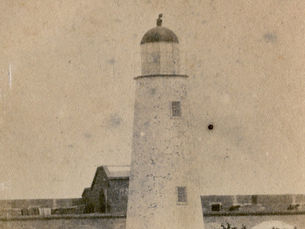 a lighthouse inside a brick fort