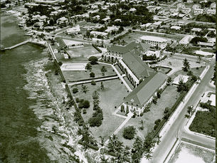 Aerial view of a large building on a shoreline