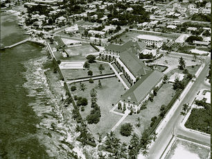 Aerial view of a large building on a shoreline