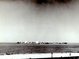 An island with two large tanks on it