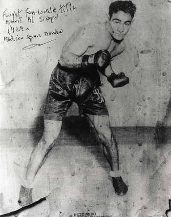 A man wearing boxing gloves and shorts. Text on photo reads fought for world title against Al Singer, 1929, at Madison Square Garden. Pete Nebo.