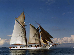 A schooner underway on the water