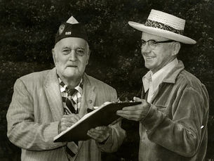 Two men with a clipboard