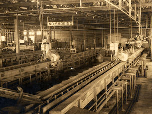 interior of a factory with a sign that reads no smoking