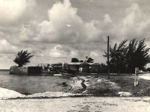 A beach leading to a brick fort structure