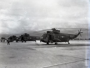 Helicopters parked at an airfield