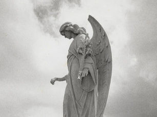 A statue of an angel looking down.