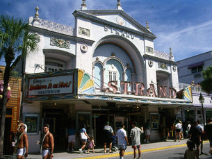 A baroque theater facade with signs reading Strand on the front and Ripley's Believe It or Not! Odditorium on the side.