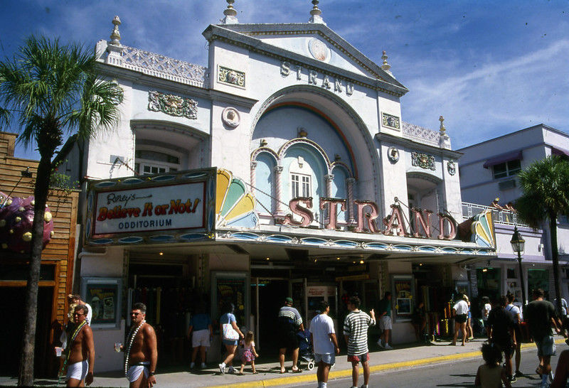 A baroque theater front with a marquee that reads Strand on the front and Ripley's Believe it or Not Odditorium on the sides.