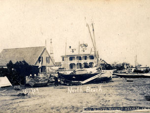 Wrecked boats on land in front of building. Text on image reads 10/11/09 North Beach and Key West's Worst Storm Oct. 11 1909
