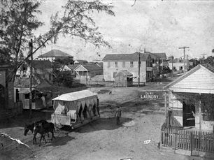 a horse-drawn tram on a street.