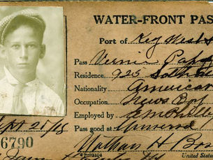 Water-front pass from 1918 in the port of Key West with a photograph of a young man. Bernie Papy, occupation News Boy.