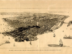 Aerial view of an island with a partially blackened area. Text at the bottom reads Key West - a bird's eye view of the city. The black portion showing the path of the fire, which began at the arrow.