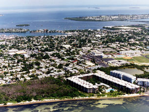 Aerial view of an island with an undeveloped area on the near shoreline.