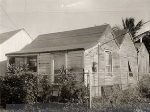 A wooden cottage with several sawtooth additions