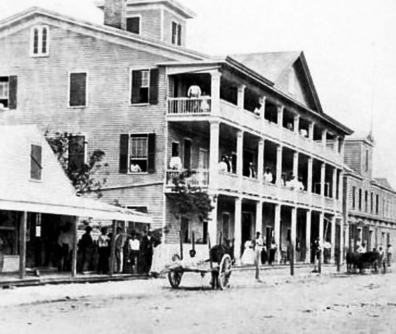 A three-story building with porches on each level.