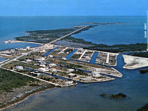 Aerial photo of an island with canals and some homes. Text with an arrow reads Zane Grey Creek.