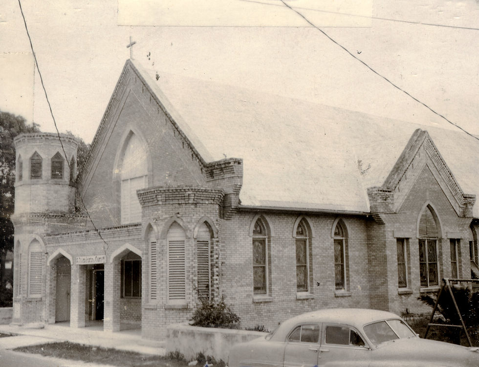 A small church made of bricks with two turrets on the front.