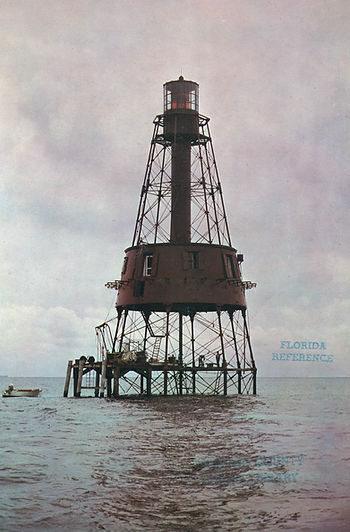 A lighthouse in the water.