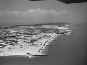 Aerial view of a mostly undeveloped shoreline