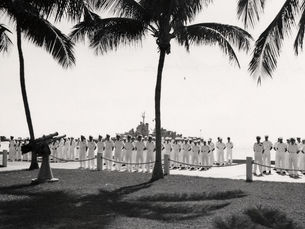 sailors lined up on a pier