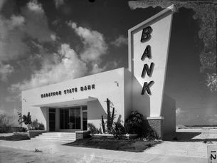 A building with a sign over the door reading Marathon State Bank and a large sign on the side reading Bank