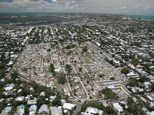 Aerial view of a cemetery with houses around it.