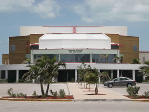 A large building with a sign that reads Tennessee Williams Fine Arts Center